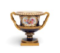 A Royal Worcester campana vase, date code for 1911, painted by Ernest Phillips with a panel of flowe