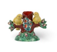 A Staffordshire pottery spill vase, early 19th century, formed as a tree trunk flanked by two yellow