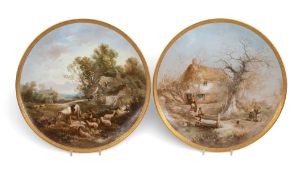 A large pair of Brownfield wall plaques, c.1860, the circular forms painted with pastoral scenes of 