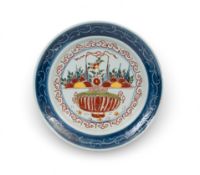 A large Delft charger, c.1735, the well painted in red, yellow, green and blue with a Chinese censer