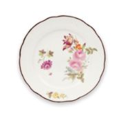 A Nantgarw 'chocolate-edged' plate, c.1818-20, painted by Thomas Pardoe with flower sprays including