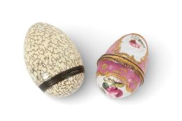 Two Bilston enamel egg bonbonnières, c.1770-80, the larger decorated with fine seaweed tendrils on a