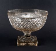 A large cut glass bowl or centrepiece, 19th century, with graduated diamond cutting beneath a vertic
