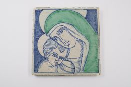 A large Continental faïence or maiolica tile, probably 20th century, painted in blue and green with 