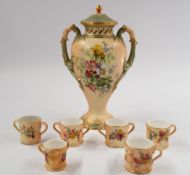 A Royal Worcester vase and cover, date code for 1901, painted with an arrangement of flowers on a bl