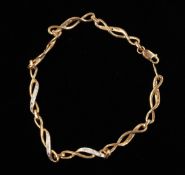 Jewellery: a 9ct gold fancy link bracelet, set with small diamonds along its length. 5.6g, 18cm.