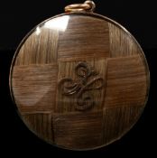 Mourning Jewellery: a yellow metal mounted mourning pendant, each side with a convex glazed panel co