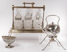 Silver Plate: a Grinsell's Patent three bottle tantalus, with key and working lock; an aesthetic per