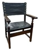 Furniture: an 18th century Baroque monk's chair or sillon de frailero. a leather seat and backrest o