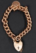 Jewellery: a 9ct rose gold curb link bracelet with heart shaped clasp, c.18cm, with attached yellow 