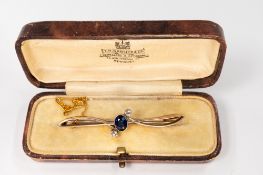 Jewellery: a blue and white paste set yellow and white metal open propeller brooch, only marked 'EET