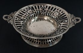 Silver: a bonbon dish by Walker & Hall, Sheffield 1906, with pierced decoration and laurel wreat