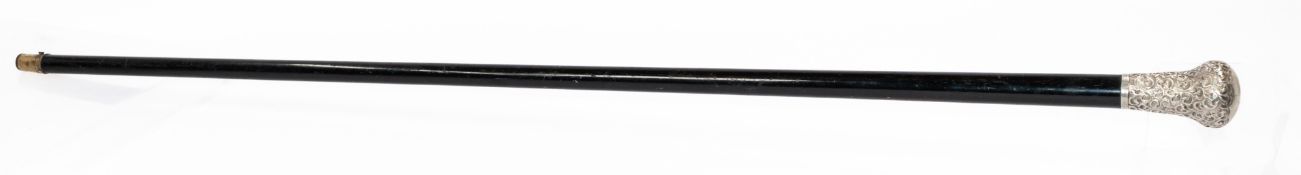 Decorative Arts: an ebonised walking cane with scroll embossed silver handle, London hallmarked, wit