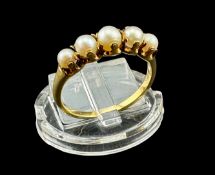 Jewellery: a continental yellow metal ring, testing as gold, claw and bolt set with five pearls. UK 