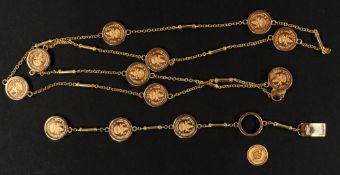 Jewellery: a yellow metal chain and bar necklace set with nine Indian 22ct gold Jaya Luckshmi temple