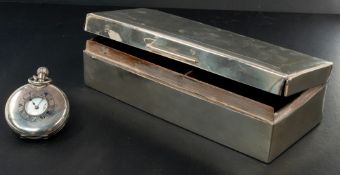 A silver cigarette box, London 1909, the rectangular form engraved with the monogrammed initials 'WS