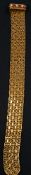 Jewellery:an 18ct yellow gold mesh bracelet, London 1959, the foldover clasp set with six alternatin
