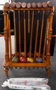 Gardenalia: an early 20th century beech and ash croquet set and stand, the mallets marked for G.Spar