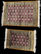 Rugs: a 20th C Bokhara rug, deep red diamonds within a light brown and blue border, approximately 14