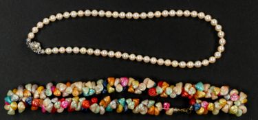Costume Jewellery: a cultured pearl necklace with silver clasp, 41cm, together with a dyed shell nec