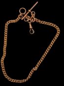 Jewellery: a 9ct rose gold curb link Albert chain, 35cm, 34.2g.