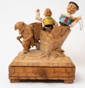 Treen: a lindenwood carved table match striker, probably Black Forest, modelled as an anthropomorphi