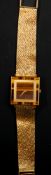 Watches: an 18ct yellow gold wristwatch by Piaget, with square tiger eye head and integral mesh stra