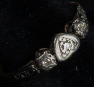 Jewellery: an 18ct yellow gold and platinum ring set a central diamond within heart shaped mount, fl