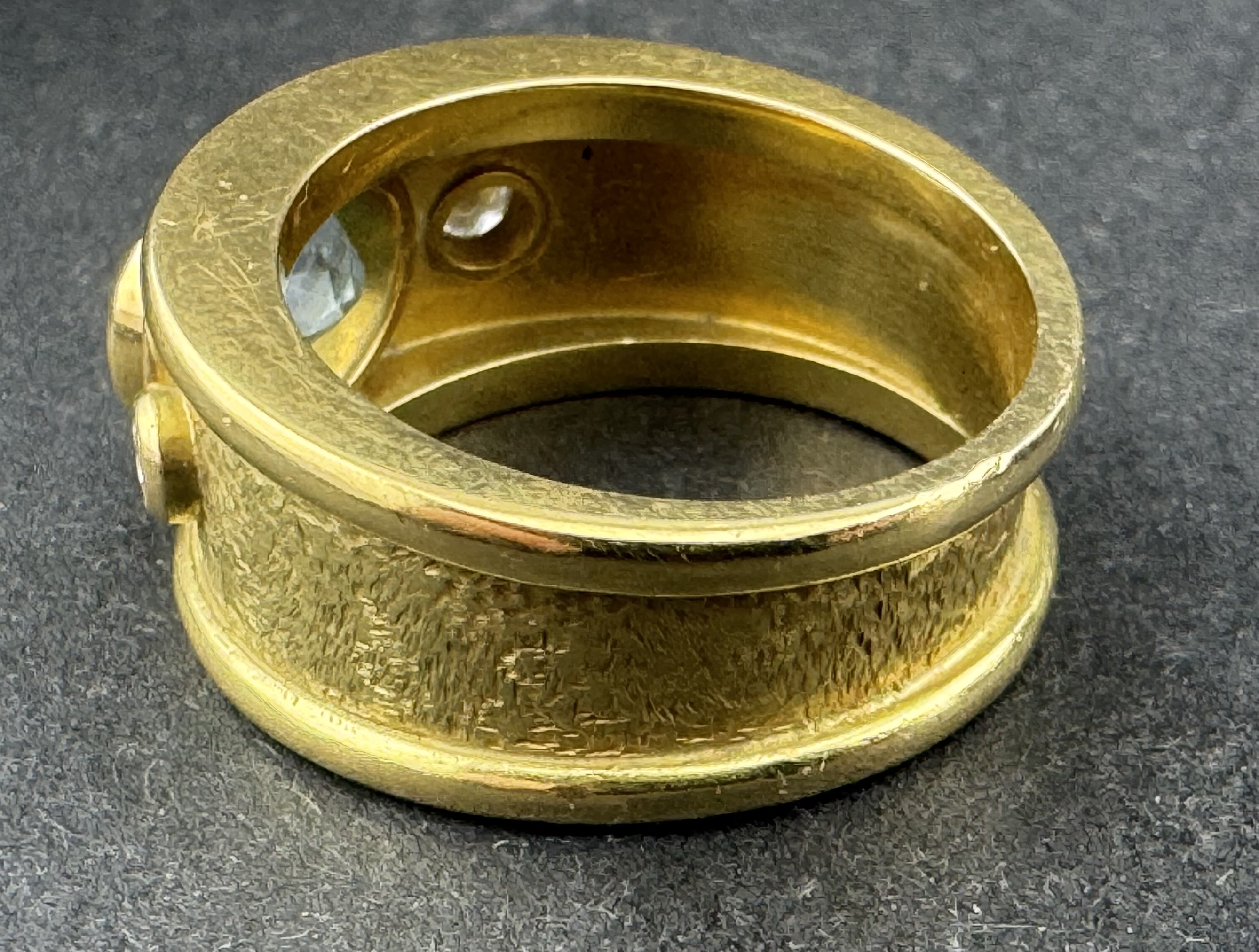 Jewellery: an unmarked yellow metal ring, testing as 18ct gold, collet set with an oval aquamarine m - Image 4 of 4
