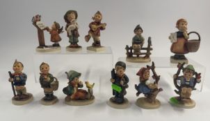 Ceramics: a collection of eleven Hummel figurines by Goebel, including 'Bird Duet', 'Little Hiker', 