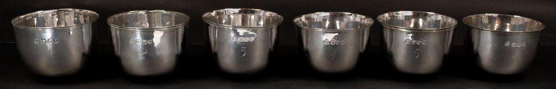 The Denis Lacy Hulbert Collection: Silver; a set of six Britannia silver stacking tumbler cups, each
