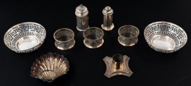 Silver: a pair of pierced bonbon dishes, Birmingham 1911; a single candle sconce; three pierced napk