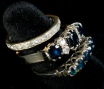 Jewellery: a white metal unmarked ring, testing as 18ct gold, claw set with five sapphires, UK size 