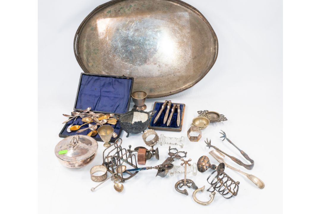 Silver Plate: a gallery tray, a boxed set of nutcrackers, two toast racks, a large volume of assorte - Image 1 of 6