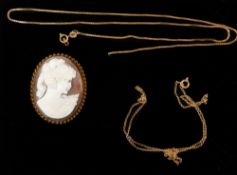 Jewellery: a 9ct yellow gold mounted shell cameo brooch carved as a young girl, together with two br