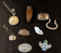 Silver: a silver mounted otter paw brooch, Birmingham 1931; two silver decanter labels; four further