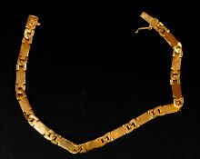 Jewellery: a yellow metal panel bracelet, bearing 916 marks and testing as high carat gold, 20cm lon