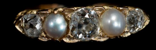 Jewellery: an early 20th century yellow metal ring, marked 15ct and testing as gold, set with three 