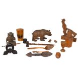 Treen: an articulated Black Forest desktop toy carved as a man having his coat pulled by a dog, tail