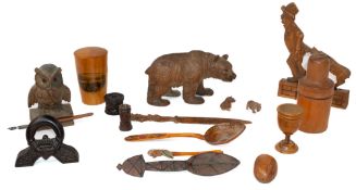 Treen: an articulated Black Forest desktop toy carved as a man having his coat pulled by a dog, tail