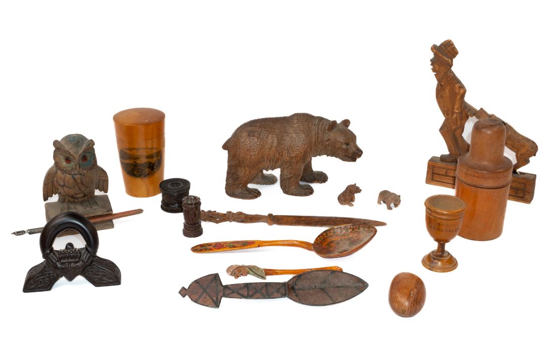 Treen: an articulated Black Forest desktop toy carved as a man having his coat pulled by a dog, tail - Image 1 of 3