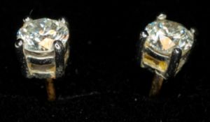 Jewellery: a pair of 18ct gold mounted diamond stud earrings for pierced ears, the stones approximat
