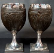 The Denis Lacy Hulbert Collection: Decorative Arts; a pair of 18th century silver mounted coconut cu
