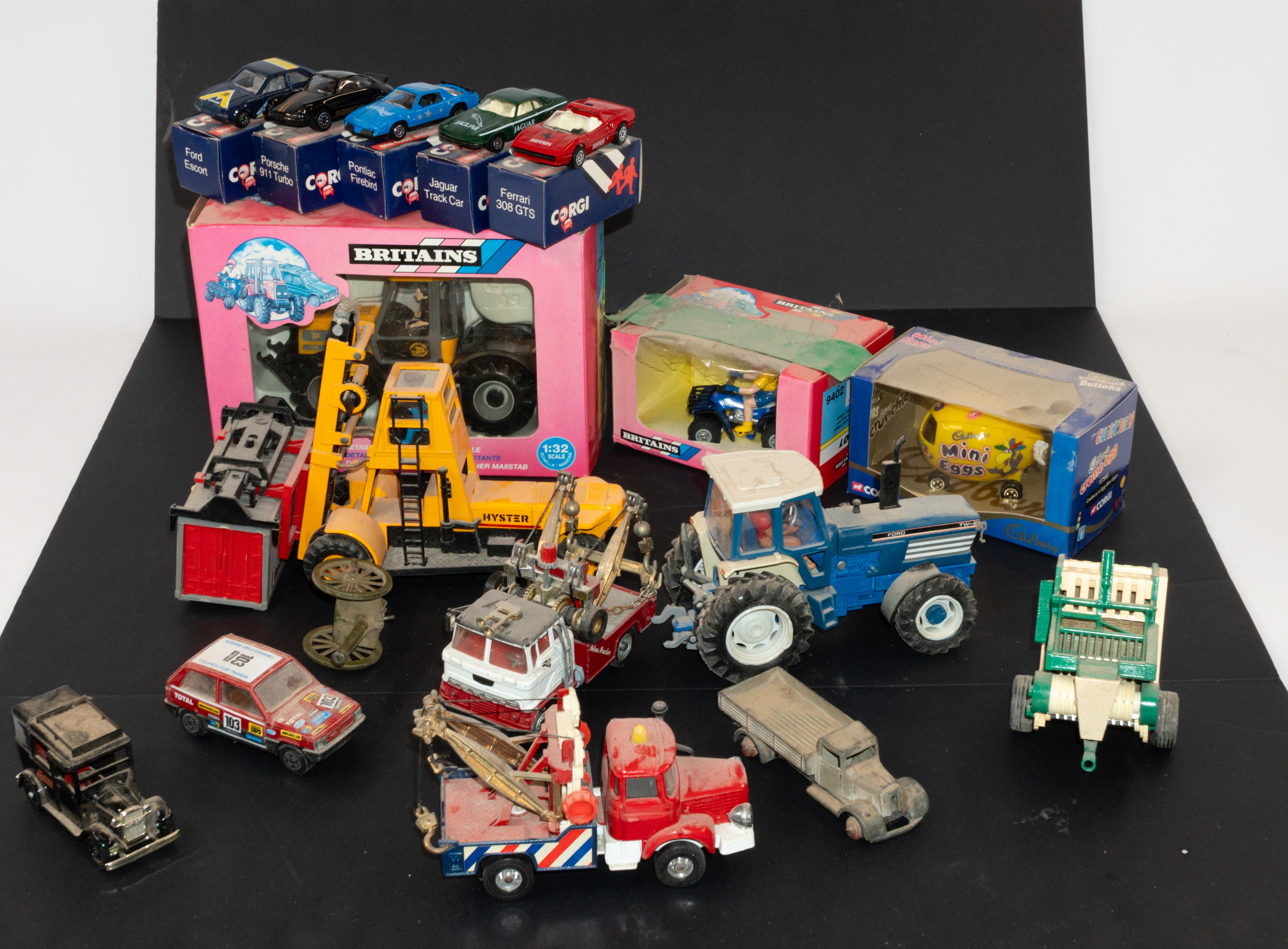 Toys: a Britains JCB Fastrac, number 9440, a Britains Honda Fourtrax 300, and five 1980s Corgi minia