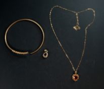 Jewellery: a 9ct gold bangle, set with four sapphires and three diamonds, a 9ct gold necklace and a 