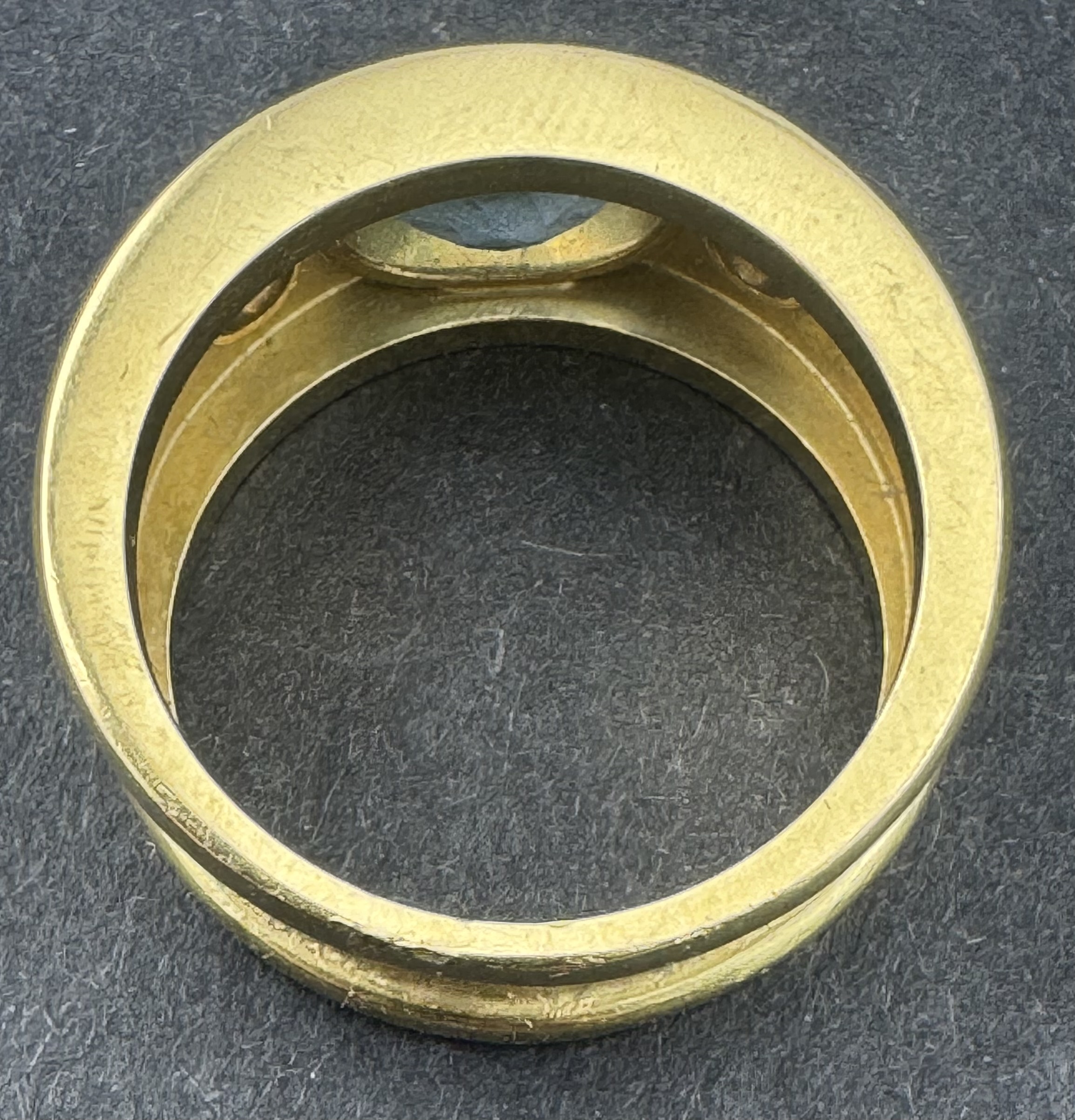 Jewellery: an unmarked yellow metal ring, testing as 18ct gold, collet set with an oval aquamarine m - Image 3 of 4