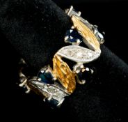 Jewellery: an unmarked naturalistic yellow and white metal ring, testing as 18ct gold, with bark eff
