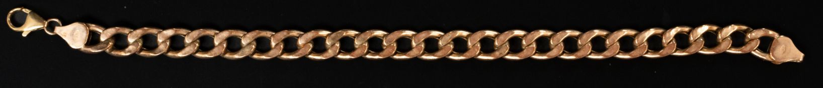 Jewellery: a 9ct yellow gold hollow curb link bracelet, 22cm long, 10.6g.