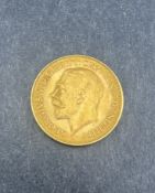 Coins: a 1913 George V 22ct gold half sovereign, circulated.