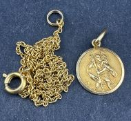 Jewellery: a yellow metal St Christopher, bearing Italian 18ct gold marks and testing as such, 1.4cm